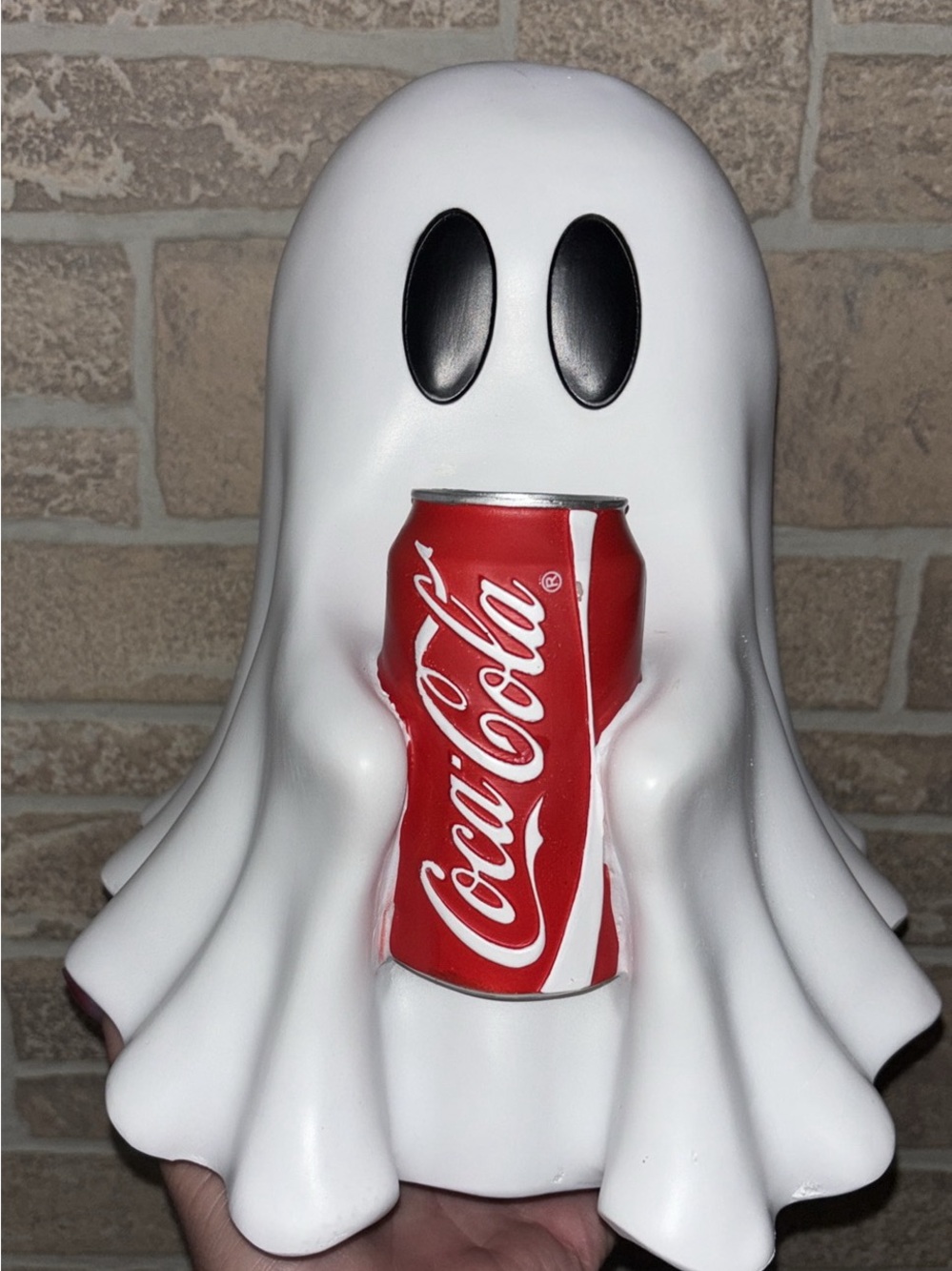 Coca Cola White Ghost holding a coke can